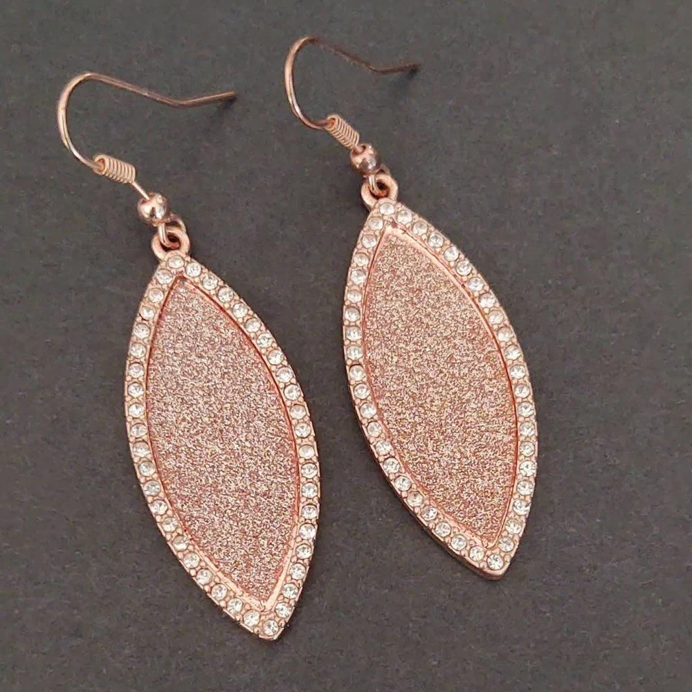 Sparkly rose gold dangle earrings with cz accents
